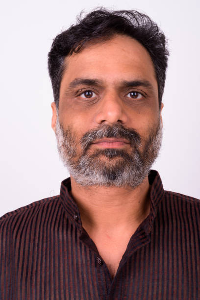 studio shot of indian man against white background